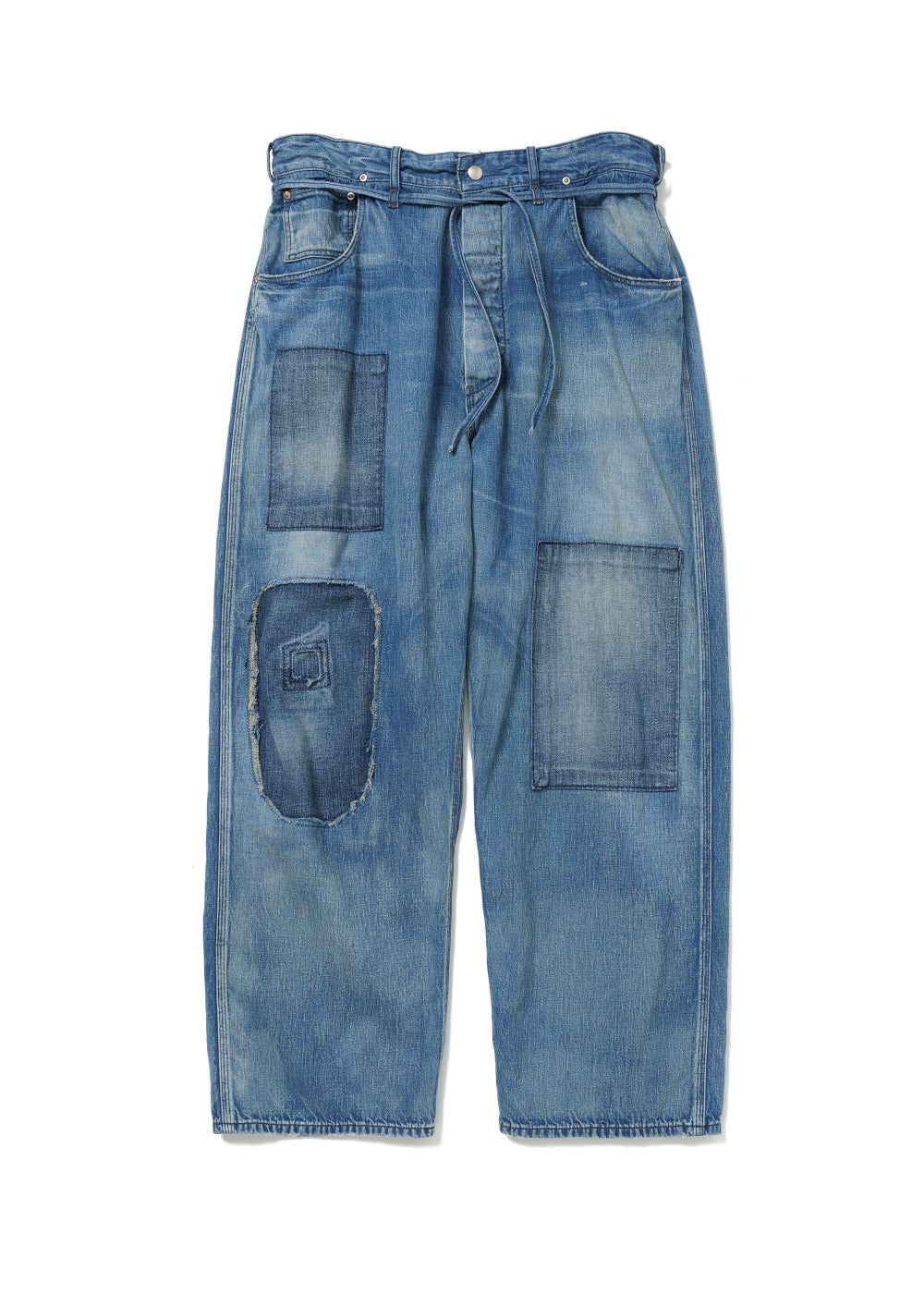 Blue denim jeans with patchwork design on a white background