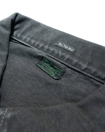 Close-up of a gray fabric with 'Fill The Bill' branding on a white background