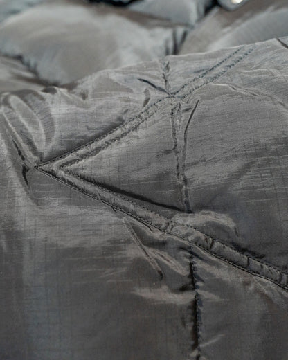 Close-up of a black ripstop fabric surface