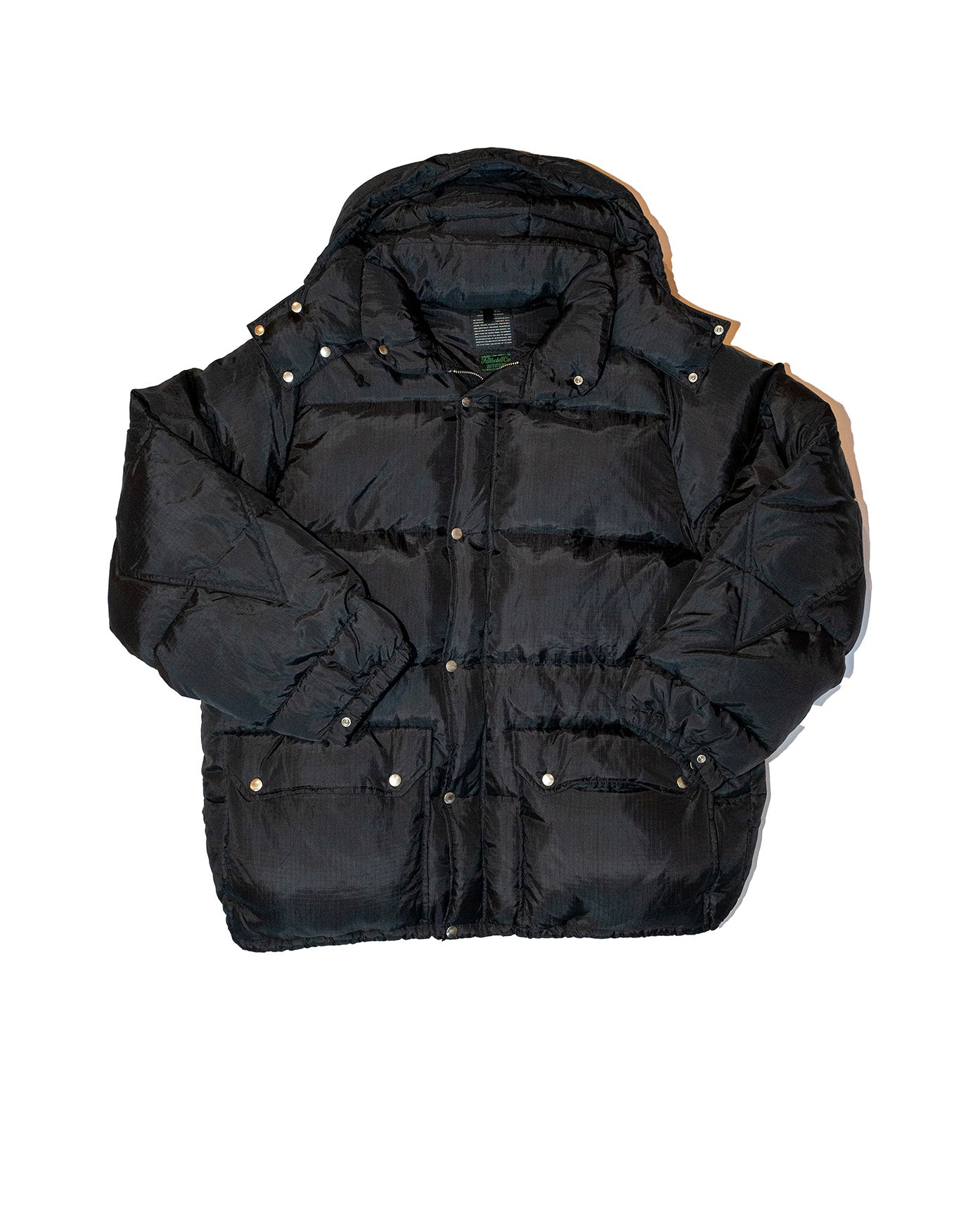Black puffer jacket on a white background